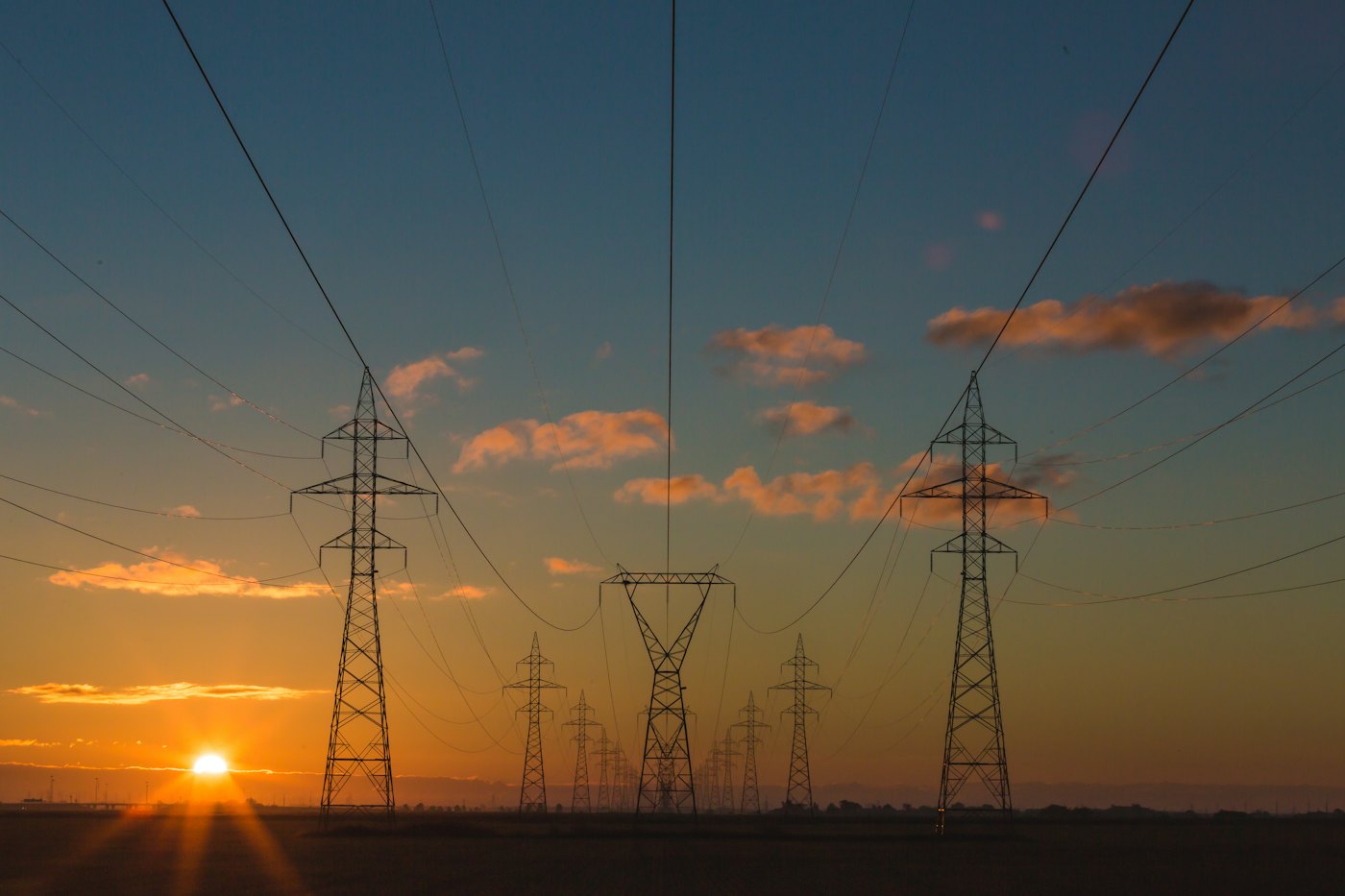 Electricity pylons at sunset