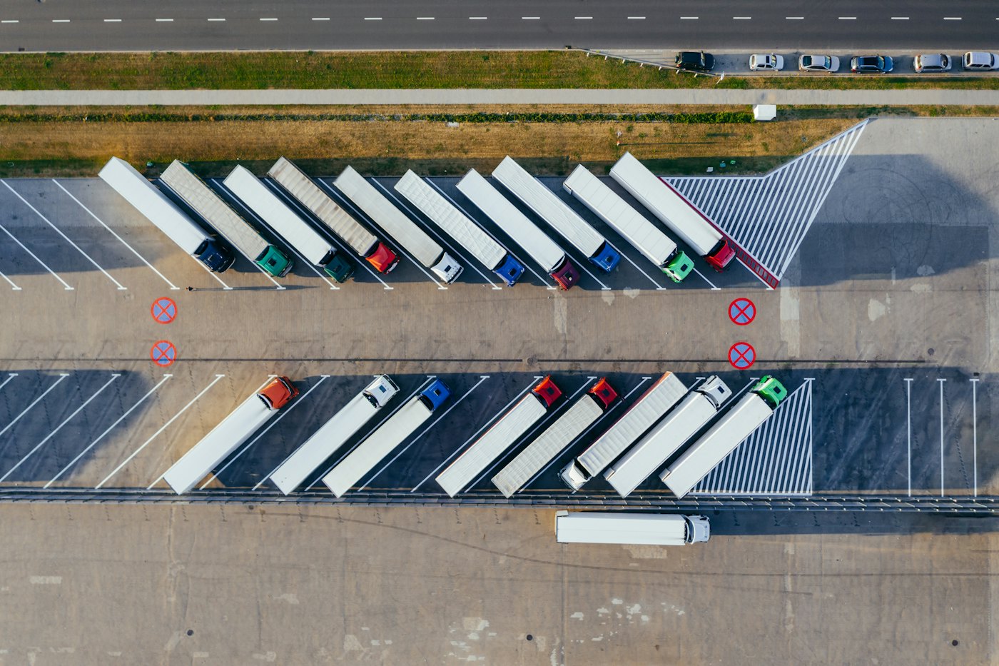 Aerial view of lorries parked at a logistics depot